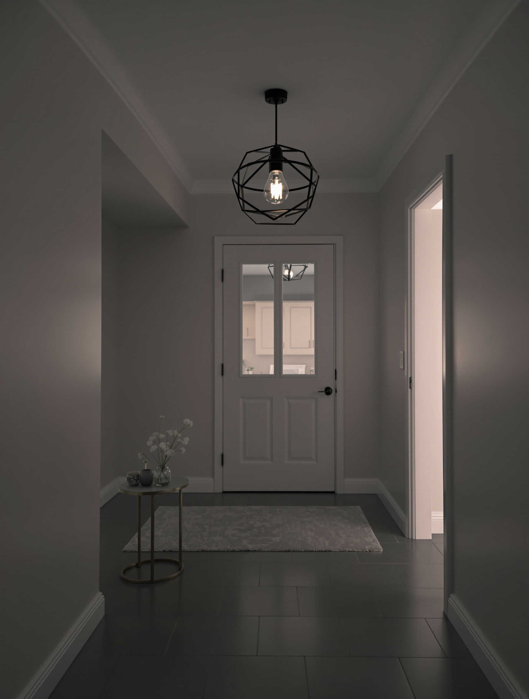 A small entryway with a geometric pendant light, a rug, and a small table with flowers.